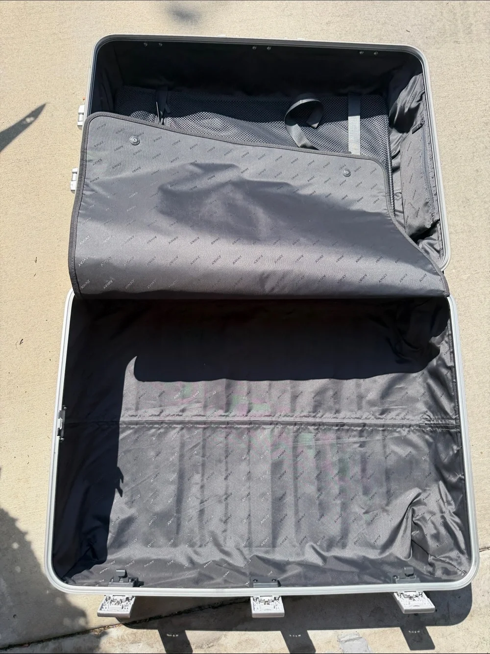 Away The Large Aluminum Edition Checked Luggage in Silver